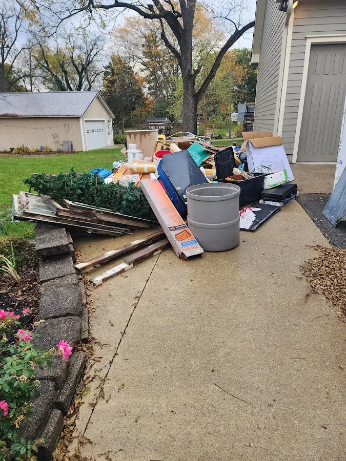 Dumpster being loaded with debris for Demolition Dumpster Rental in South Middleton